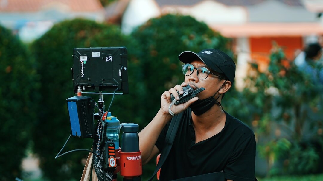 Mobile reporter speaking into a microphone outdoors